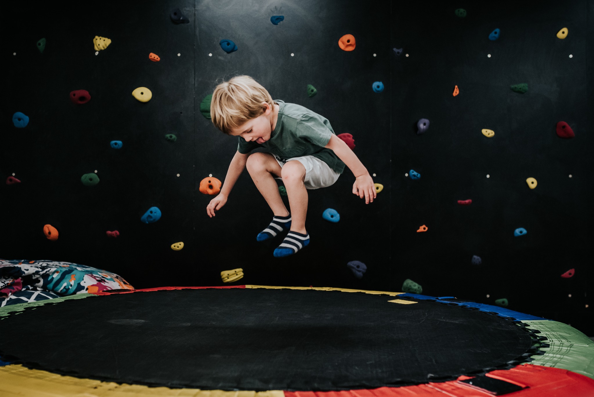 A child enjoying movement and play on a trampoline